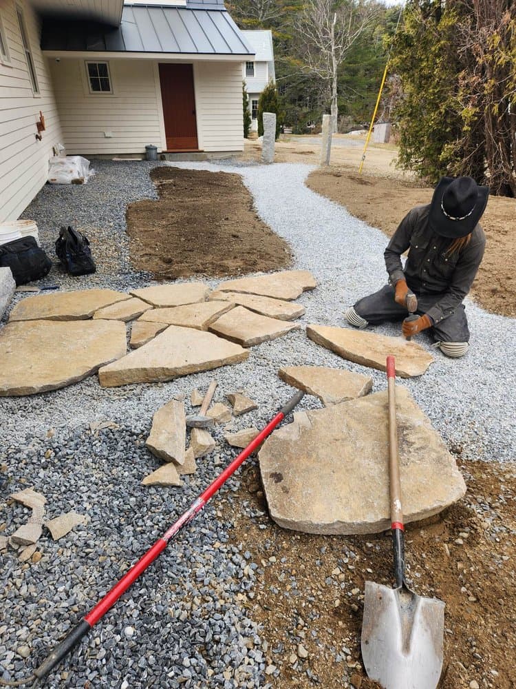 mason-cutting-granite-walkway